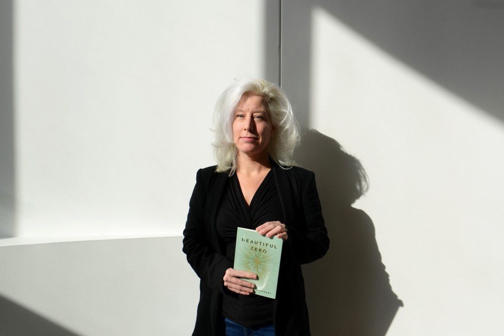Poet Jennifer Willoughby, an alum of the Creative Writing program at the University, stands for a portrait in the Weisman Art Museum, where she will recite her first published book of poetry, Beautiful Zero, as part the English Departments First Books event.