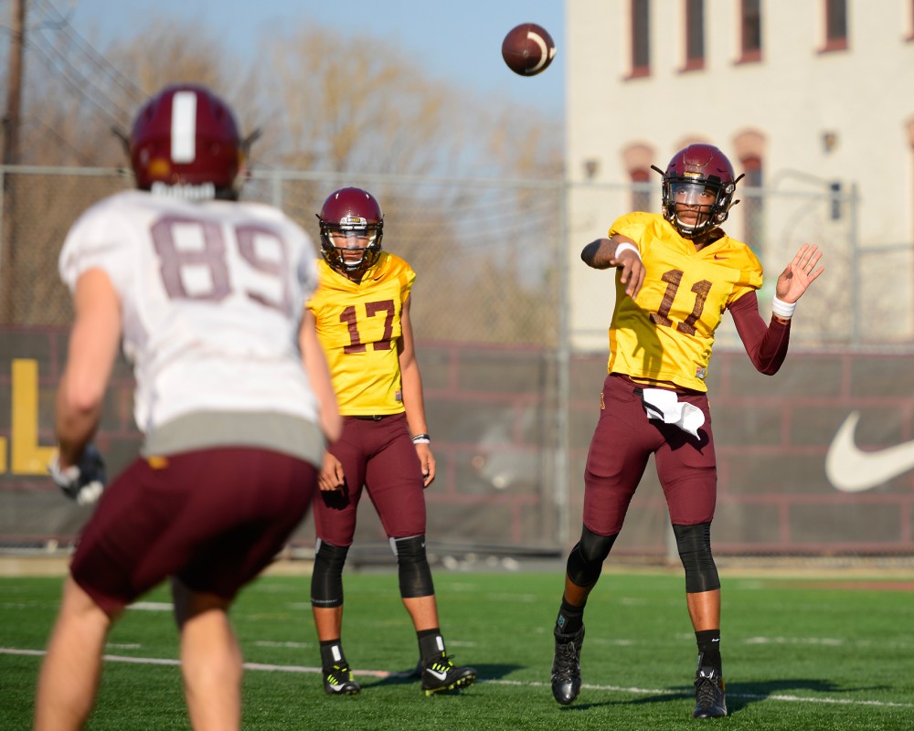 Sophomore quarterback Demry Croft throws the ball to another Gophers player during the first spring football practice of the year at the Gibson-Nagurski Football Complex on March 10. 