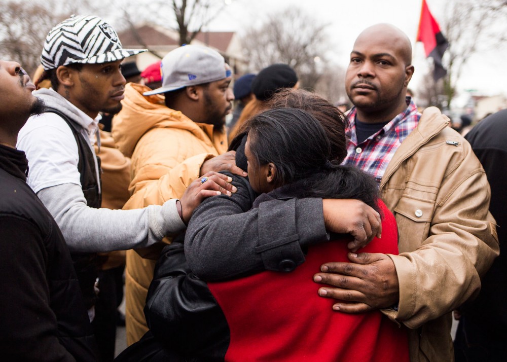 Members of Jamar Clarks family mourn together at the site of his shooting on Plymouth Avenue North on Wednesday. While some demonstrators marched to the Hennepin County Government Center, others chose to remain behind at the memorial. The days demonstrations came after Hennepin County attorney Mike Freeman announced his decision to not charge MPD officers Mark Ringgenberg and Dustin Schwarze, who were involved in Clarks death.