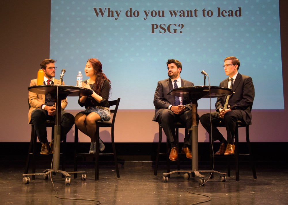 Left to right, Michael Blomquist, Sumee Lee, Max Hall and Dane Thompson gather onstage for the Professional Student Government presidential and vice presidential candidate debate on Wednesday in the Coffman Union Theater.