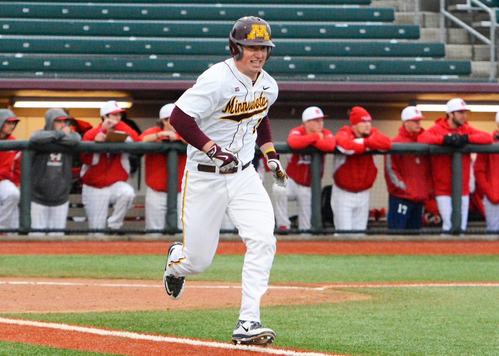 Gophers catcher Austin Athmann runs to first base after hitting a home run at Siebert Field where the Gophers played against Saint Marys on Wednesday afternoon. 