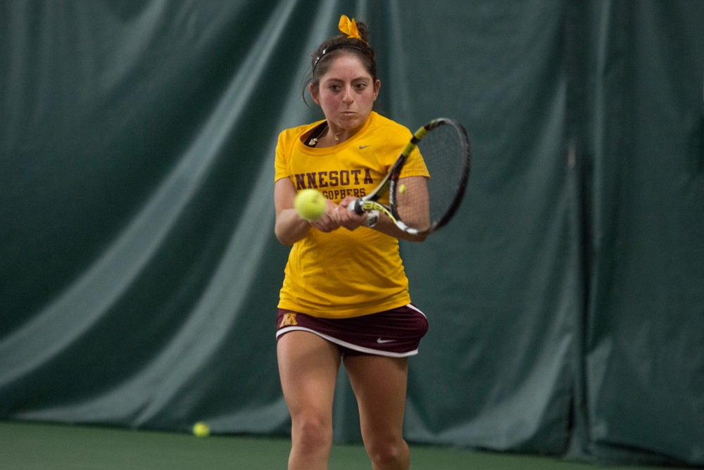 Camila Vargas Gomez returns a shot during a match against Michigan State University Friday at Baseline tennis center. The Gophers defeated Michigan State University 5-2.