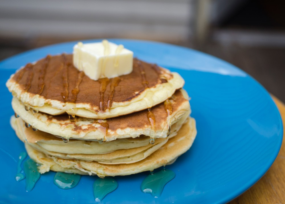 Greek yogurt pancakes, topped with honey and butter. 