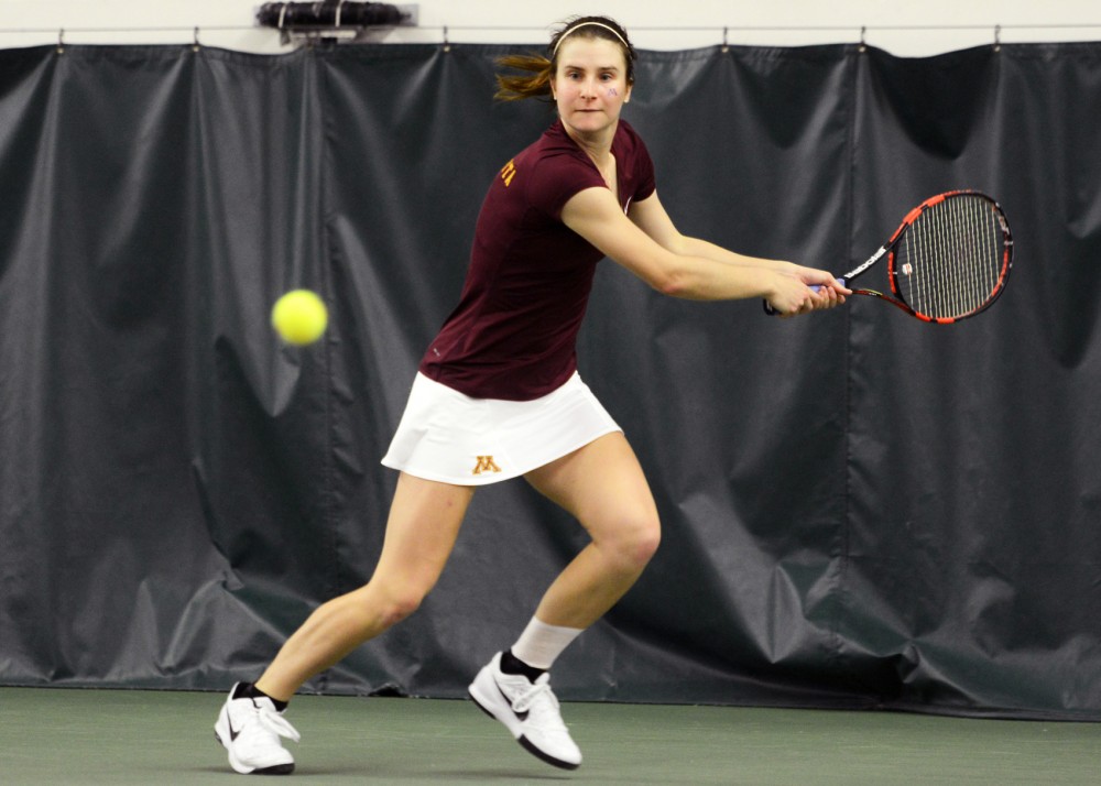 Sophomore Caroline Ryba prepares to return the ball to Penn State in the Baseline Tennis Center Friday, March 18.