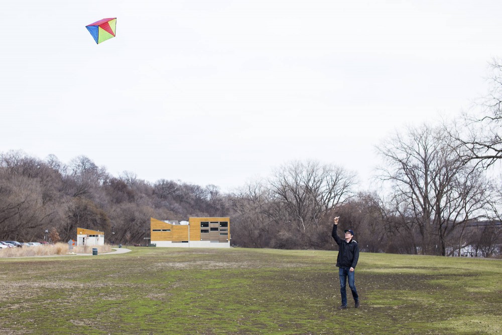Taking advantage of the strong winds, sophomore Jack Lange flies his kite by the Mississippi on the East River Flats.