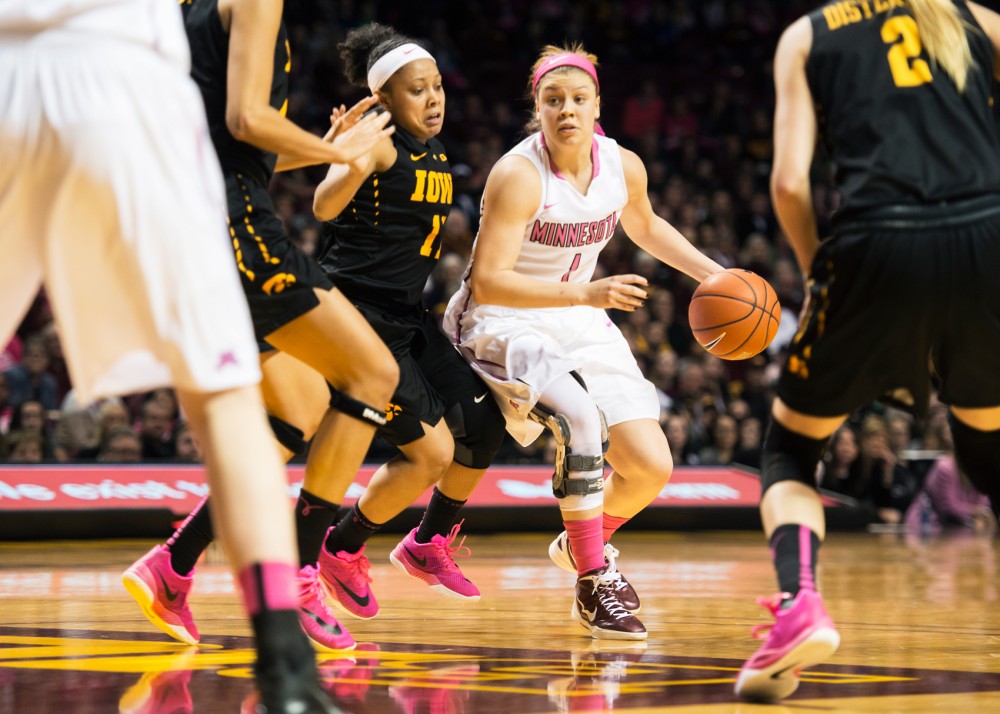 Rachel Banham looks to pass the ball during the second quarter at Williams Arena on Feb 15.