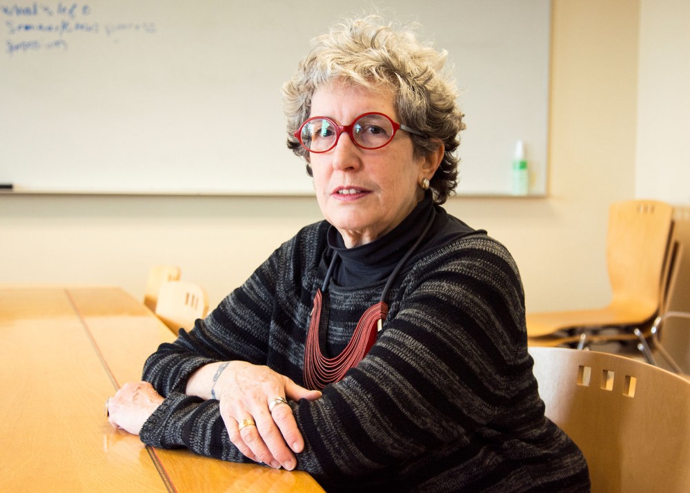 Naomi Scheman, a professor of Philosophy and Gender, Womens and Sexuality Studies, poses in a conference room in Ford Hall on Tuesday. Scheman has served as both the chair of the Gender, Womens and Sexuality Studies department and as the Director of Graduate Studies, and will be retiring at the end of Spring semester.