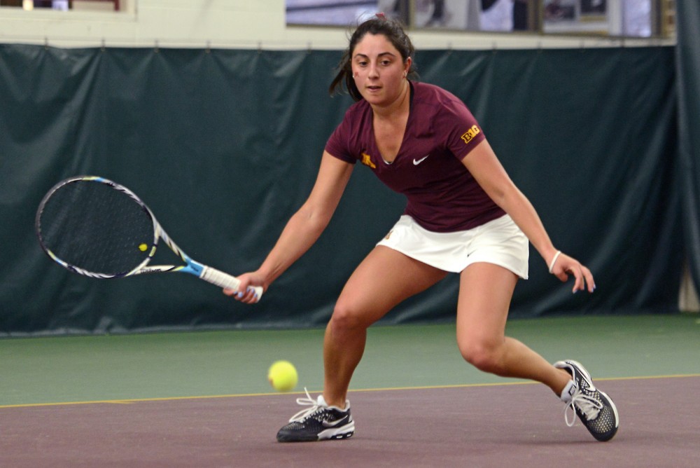 Freshmen AnneMarie Emme returns the ball to Penn State Friday, Mar. 18 in the Baseline Tennis Center. 