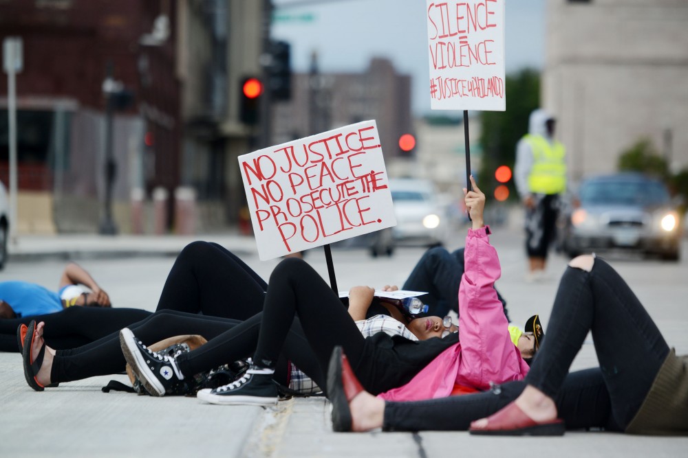 Protesters lie down in the middle of Kellogg Boulevard on Tuesday, Sept. 6, 2016 in St. Paul for a  die in in part of the If We Dont Get It rally, which was organized to raise awareness in advance of the announcement on whether Officer Jeronimo Yanez will be indicted.