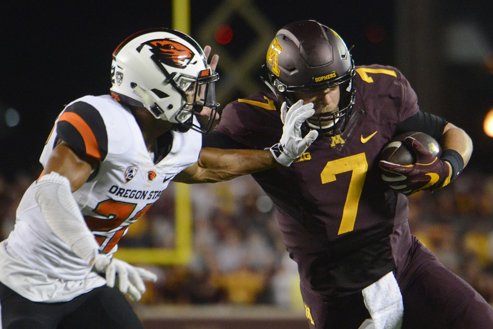 Gophers quarterback Mitch Leidner runs the ball while an Oregon State player attempts to tackle on Thursday, Sept. 1, 2016 at TCF Bank Stadium. 
