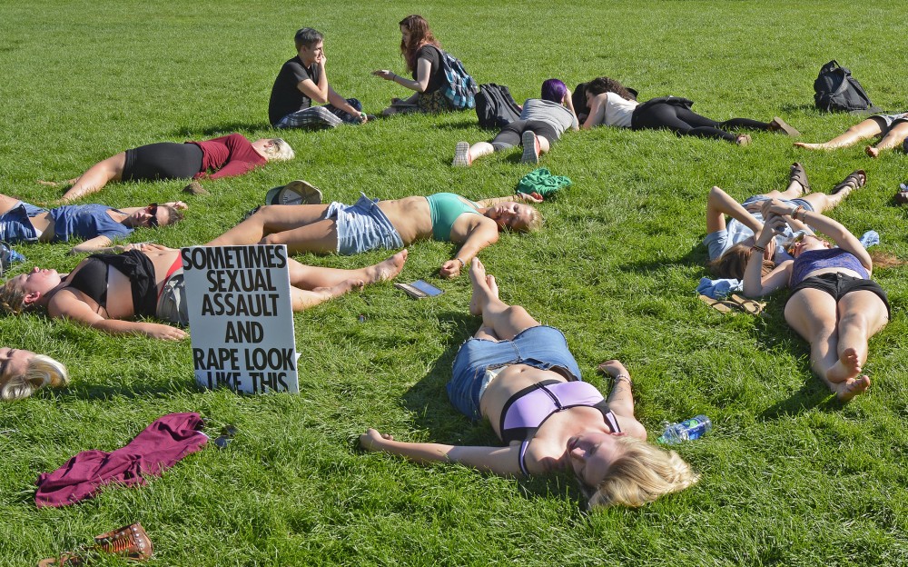 Students protest to raise awareness of campus sexual assault on Thursday, Sept. 8, 2016 on Northrup Mall. 