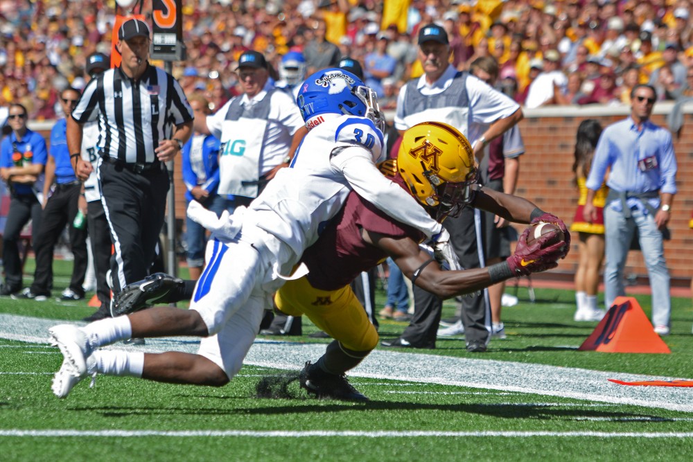 Freshman wide receiver Tyler Johnson completes a pass for a touchdown against Indiana State on Saturday, Sept. 10, 2016 at TCF Bank Stadium.