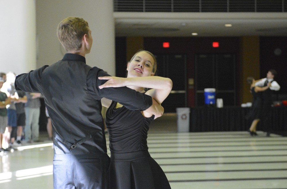 Math senior Calvin Westrick dances the waltz with Shelby Gilliland at Fall into Dance on Sunday, Sept. 11, 2016 in Coffman Memorial Union. I came to this event last year and now Im somehow performing, Westrick said. 