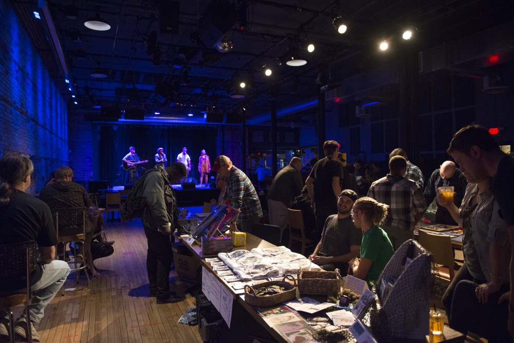 Comic Artists sell art to attendees listening to indie rock music on Saturday, Sept. 10, 2016 at the Bedlam Theater in St. Paul, Minnesota.