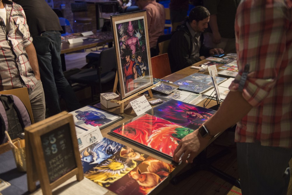 Comic artists display work as attendees listened to various artists perform on Saturday, Sept. 10, 2016 at the Bedlam Theater in St. Paul, Minnesota.