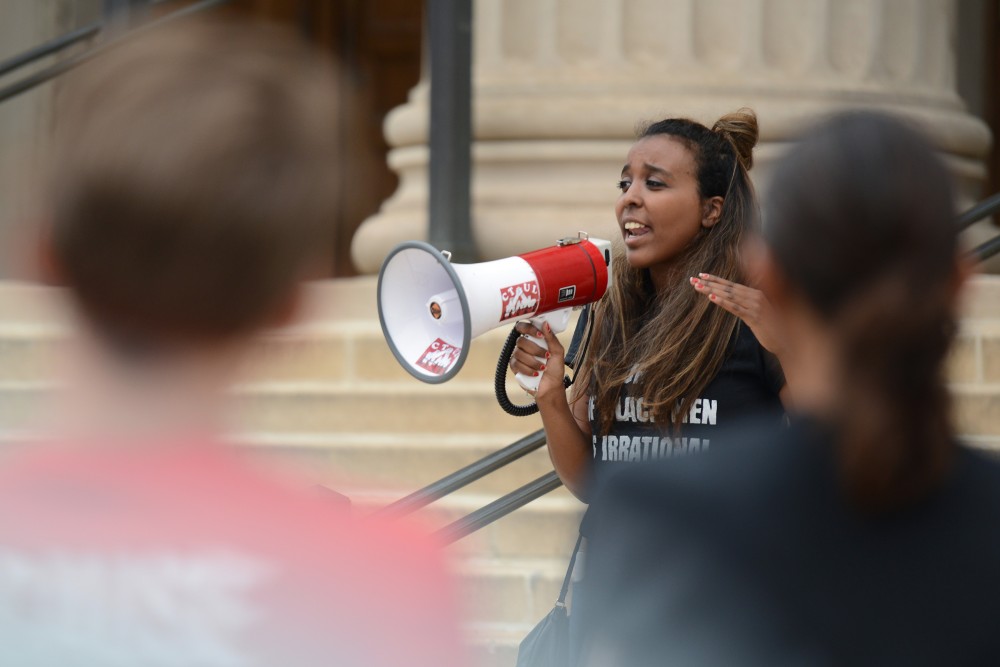 Organizer Rachel Haile speaks to protesters on Friday, Sept. 23, 2016 at Northrop Plaza. Student coalition Differences Organized gathered to protest the treatment of contingent faculty.