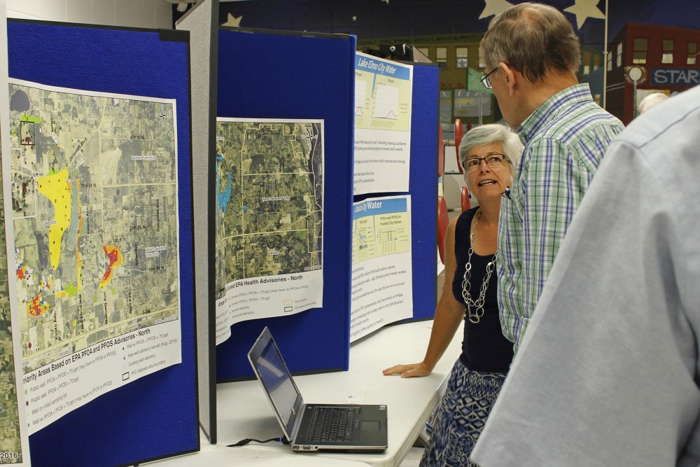 Hydrogeologist for the Minnesota Department of Health Virginia Yingling explains data on local water to visitors at a public meeting at Oakland Middle School on Sept. 19 2016.  