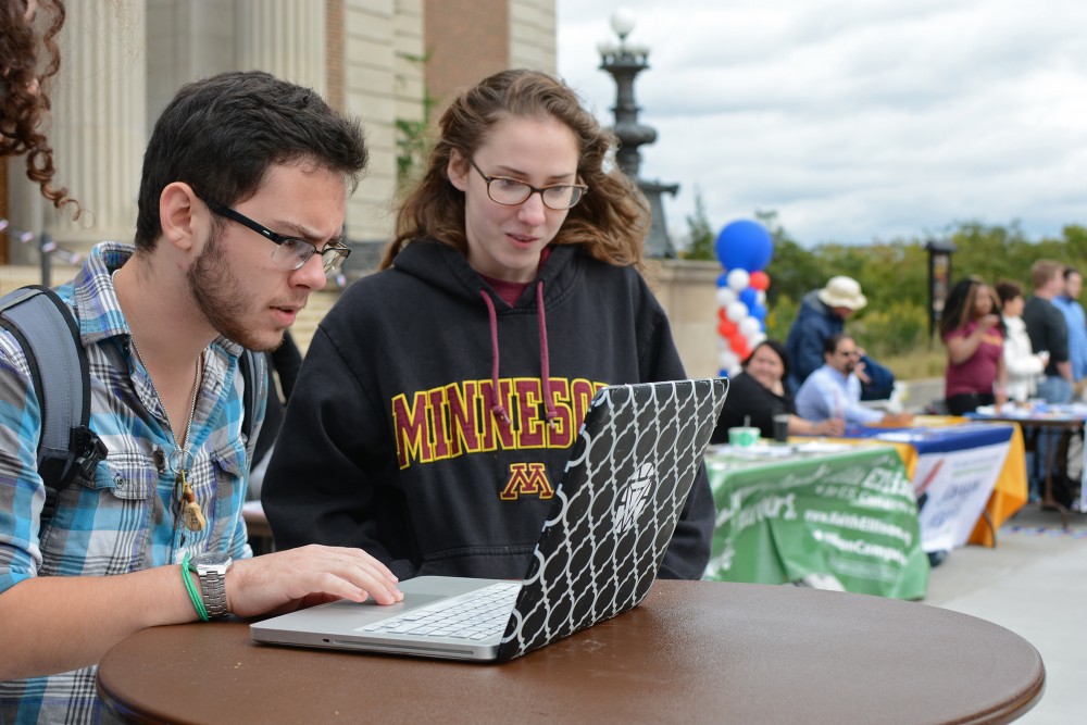 Sophomore Lev Gringauz registers to vote with the online software TurboVote at Voterpalooza hosted by MSA on Tuesday, Sept 27, 2016 at Northrop Plaza. MSA decided to use TurboVote this year to increase student registration on campus for the upcoming election. 