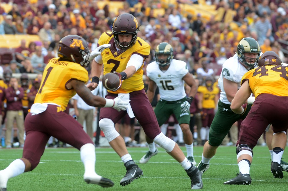 Gophers quarterback Mitch Lender hands the ball off to running back Rodney Smith on Saturday, Sept. 24, 2016 at TCF Bank Stadium. 