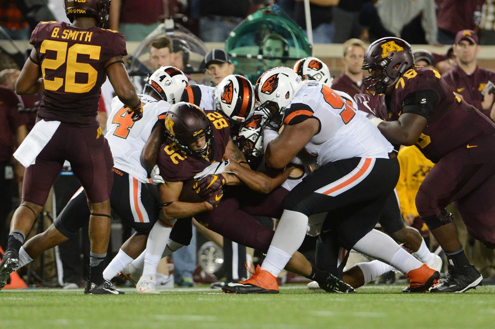 Gophers wide receiver Drew Wolitarsky is taken down by Oregon State Beavers on Thursday, Sept. 1, 2016 at TCF Bank Stadium. 