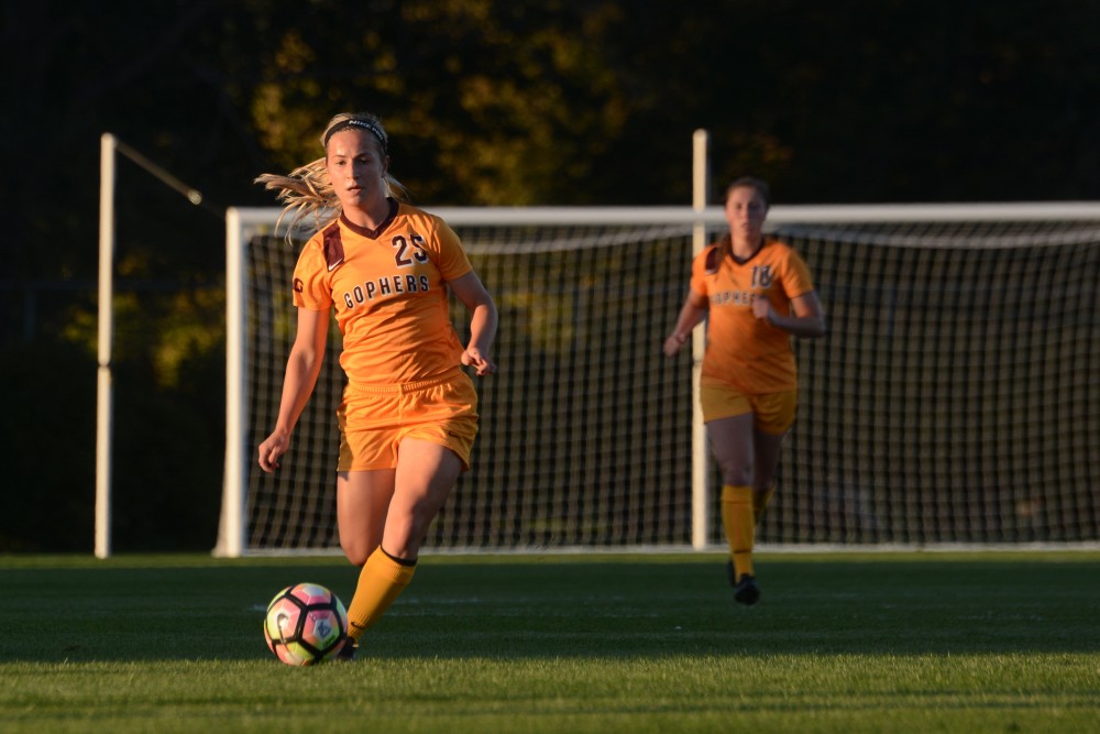 Junior midfielder Megan Koenig drives the ball down the field on Saturday, Oct. 1, 2016 at Elizabeth Lyle Robbie Stadium in St. Paul. Minnesota lost to Wisconsin in overtime 1-0 after both teams went scoreless through the game. 