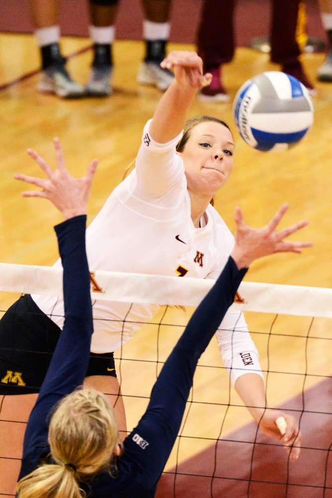 Middle blocker Hannah Tapp spikes the ball against Penn State in the Sports Pavilion on Nov. 14, 2015.