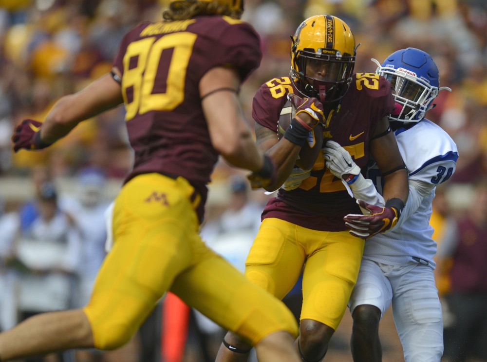 Junior wide receiver Brian Smith is tackled on Saturday, Sept. 10, 2016 at TCF Bank Stadium while playing against Indiana State.
