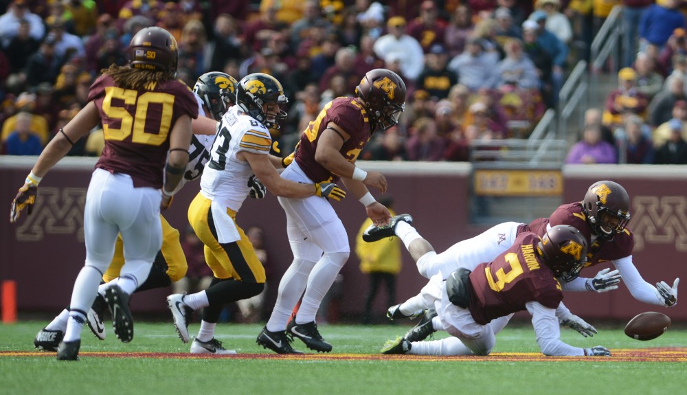 Gophers dive for the ball after an incomplete play on Oct. 8, 2016 at TCF Bank Stadium.