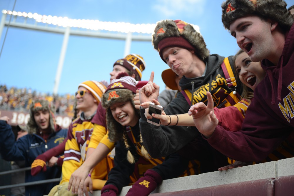 Fans cheer on the gophers from the student section on Saturday, Oct. 8, 2016 at TCF Bank Stadium.