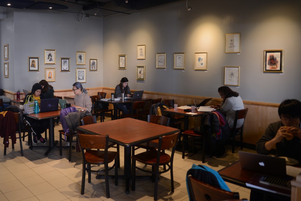 Customers work and sip coffee at Humble Cup coffee shop on Oct. 9, 2016.