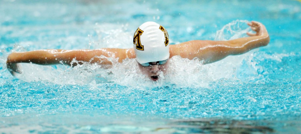 Kierra Smith swims the 100-yard butterfly against Iowa State on Friday, Oct. 12, 2012,  at the University Aquatic Center.