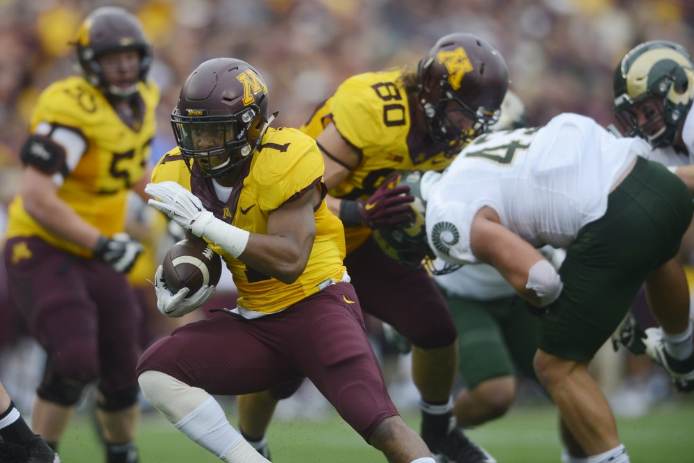Redshirt sophomore running back Rodney Smith carries the ball on Saturday, Sept. 24, 2016 at TCF Bank Stadium, where the Gophers beat the Rams 31-24.