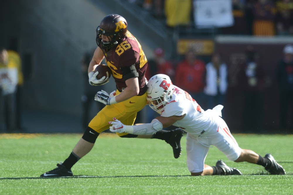 Tight end Brandon Lingen is tackled on Saturday, Oct. 22, 2016 at TCF Bank Stadium.