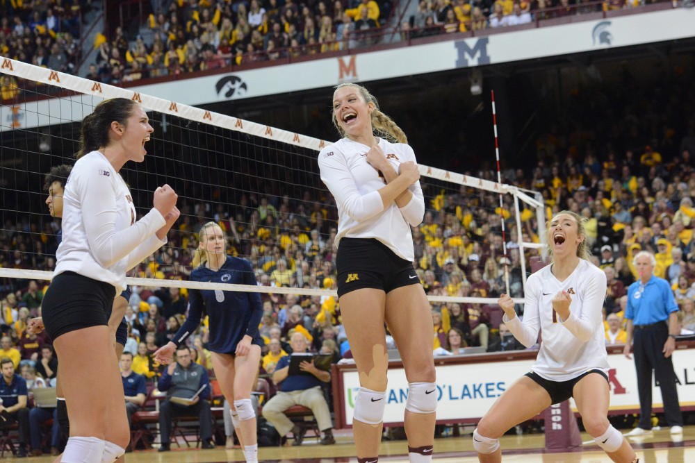 The Gophers cheer after scoring a point against Penn State on Saturday Oct. 29, 2016 in the Sports Pavilion.