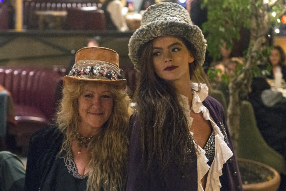 Designer Shelley Wade walks with a model at the end of her show at the Loring Pasta Bar on Oct. 30, 2016. Wades creations have a Gypsy influence and were originally intended to be shown to Prince in a private show.