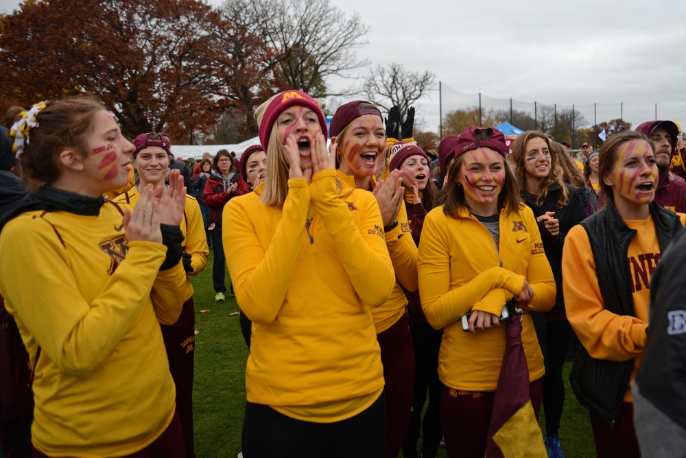Gophers fans cheer on their team as they receive metals at the big ten cross county meet on Sunday, Oct. 30, 2016 at Les Bolstad Golf Course.