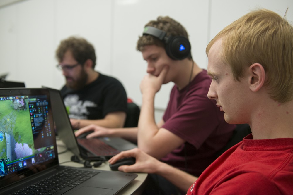 Geography sophomore Ryan Mercurio, right, plays Dota 2 on Wednesday, Oct. 26, 2016 at Bruininks Hall on East Bank. The team participates recreationally as well as in the Collegiate Star League, where teams from colleges and universities in North America play competitively for prizes. 