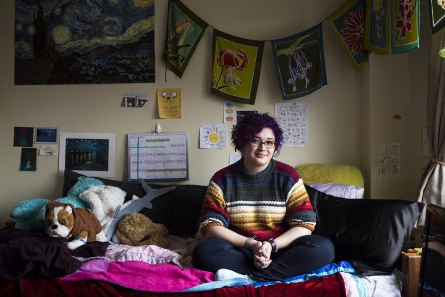 Sophomore Sammy Miller sits on her bed in her Comstock Hall single dorm room on Friday, Jan. 29. Miller, who has borderline personality disorder, seeks treatment for her illness outside of the services offered at the University. Miller says her therapist equates the work she does in therapy to taking a five-credit college course.