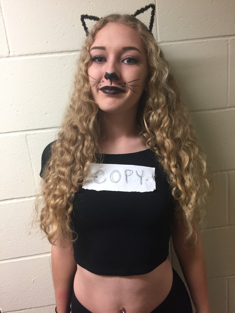 Freshman Jenna Pleshnek takes a break from Halloween weekend festivities on Saturday October 29 to pose for a portrait in her copy cat costume.