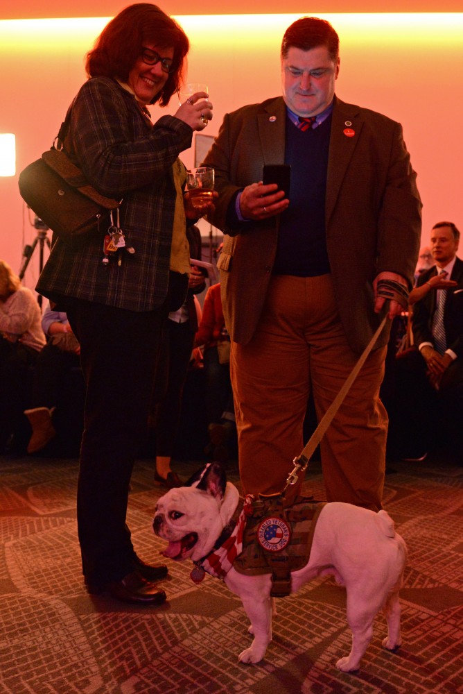 Lloyd Cheney brings service dog LeRoy to the election party on Tuesday, Nov. 8, 2016 at the Radisson Blue Mall of America in Bloomington.