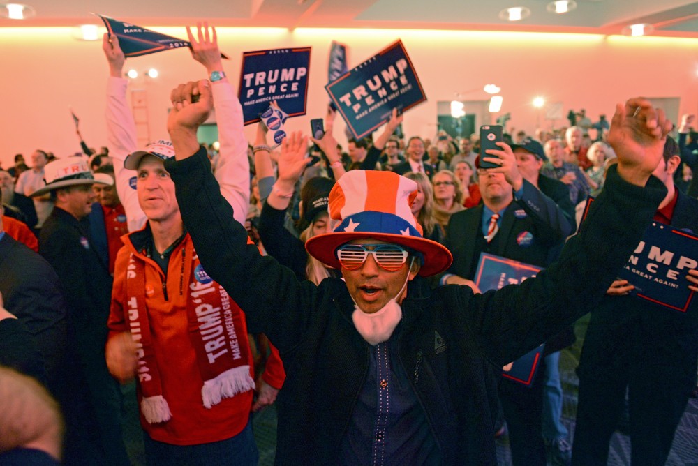 Preston Rodrigues celebrates as another state is called for Donald Trump on Tuesday, Nov. 8, 2016 at the Radisson Blue Mall of America in Bloomington.