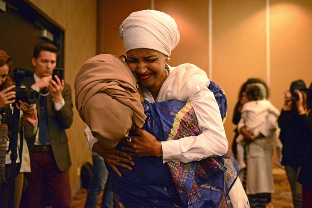 Campaign volunteer Habon Abdulle embraces Ilhan Omar on Tuesday, Nov. 8, 2016 at the  Courtyard Marriott on West Bank in Minneapolis. Omar won the seat for House 60B.