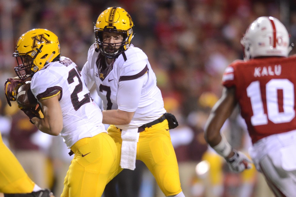 Gophers quarterback Mitch Leidner hands the ball to tailback Shannon Brooks during the game against the Cornhuskers at Memorial Stadium in Lincoln, Nebraska on Saturday, Nov. 12, 2016. 