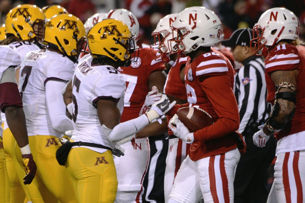 Gophers corner back Jalen Myrick congrates Cornhuskers wide receiver Alonzo Moore on their win during the last few seconds of the fourth quarter at Memorial Stadium in Lincoln, Nebraska on Saturday, Nov. 12, 2016.
