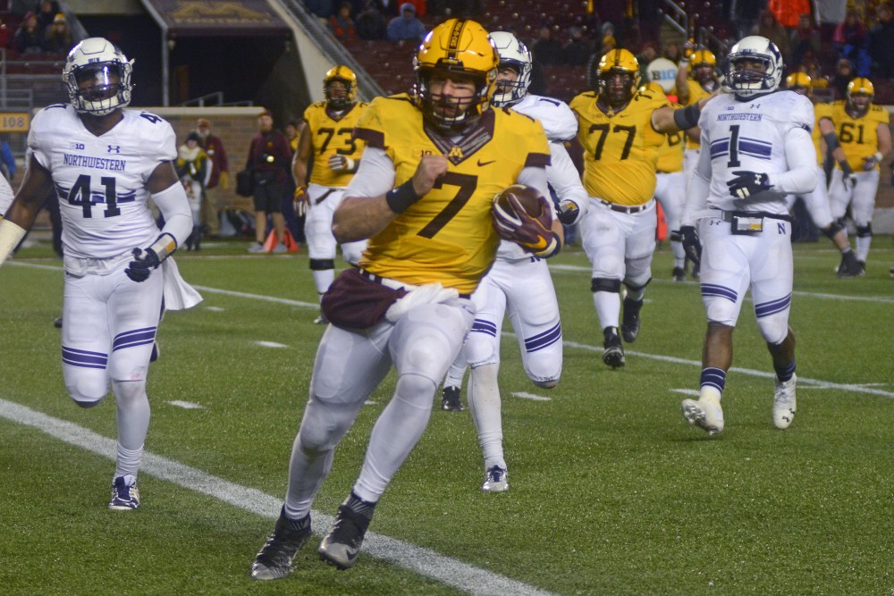 Minnesota quarterback Mitch Leidner runs into the end zone for the final touchdown against Northwestern. Minnesota won 29-12 against Northwestern. 