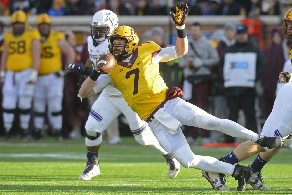 Senior quarterback Mitch Leidner makes a last second pass before falling at TCF Bank Stadium on Saturday, Nov. 19, 2016. The Gophers would win 29-12 against Northwestern University.