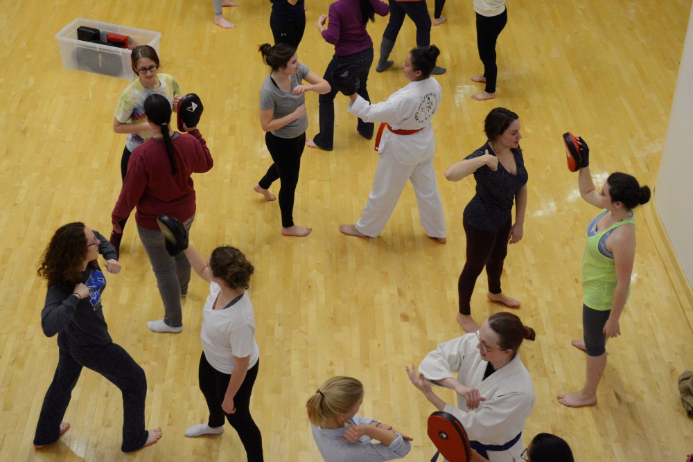 Attendees of a womens self defense seminar at the Recreation and Wellness Center practice punching on Nov. 30, 2016. 