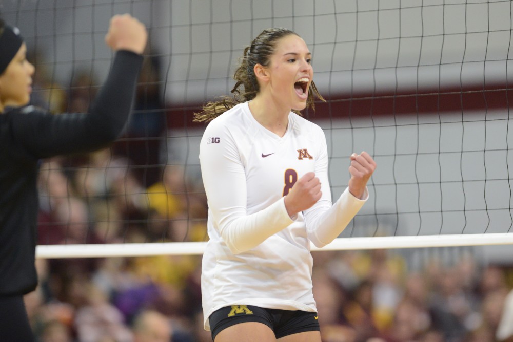 Senior outside hitter Sarah Wilhite cheers after the gophers score a point on Saturday, December 3. 2016 at the Sports Pavilion. The Gophers won against the University of Hawaii.