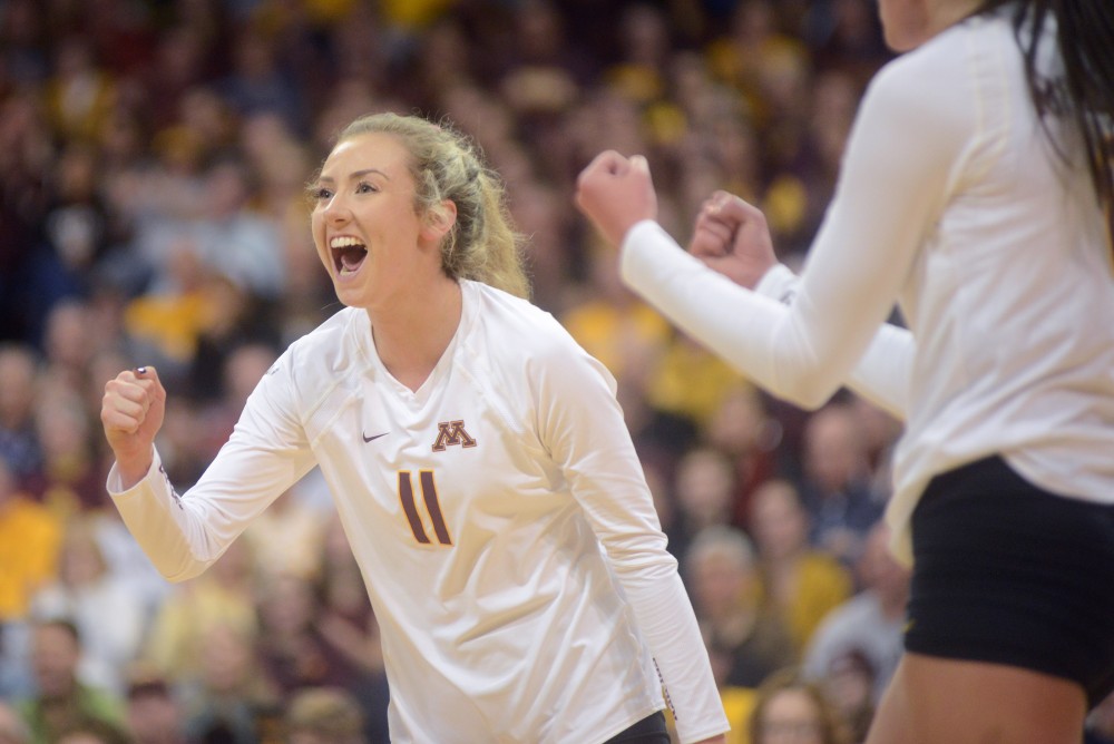 Sophomore setter Samantha Seliger-Swenson cheers after the gophers score a point on Friday, December 2. 2016 at the Sports Pavilion. The Gophers won against the University of North Dakota.