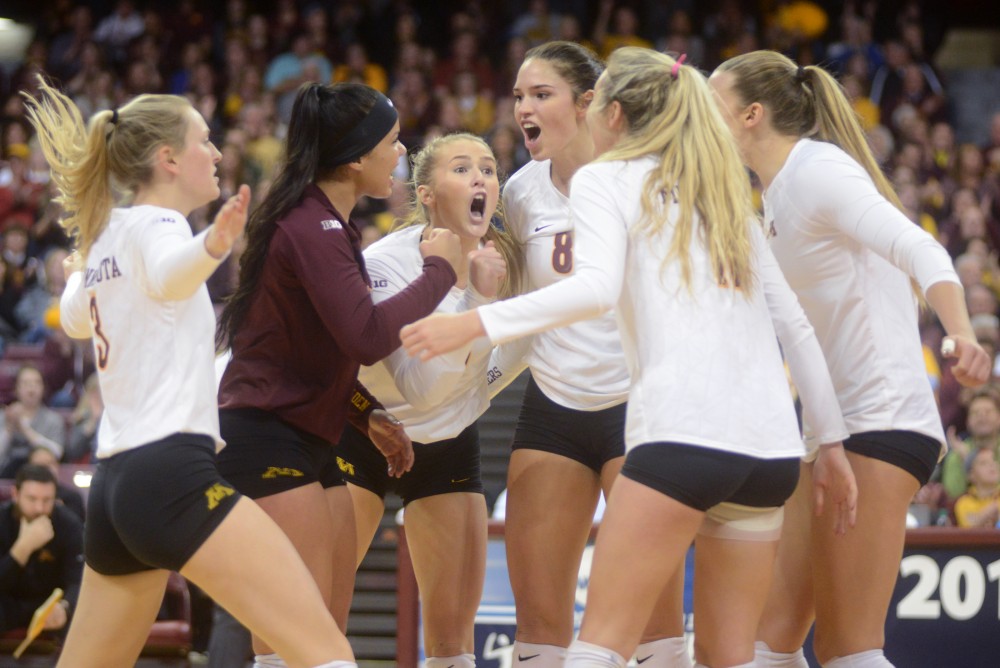 The gophers celebrate after scoring a point on Friday, December 2. 2016 at the Sports Pavilion. The Gophers won against the University of North Dakota.